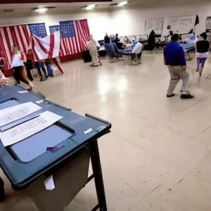 Artistic representation for Election workers have safety concerns as DOJ files charges for threats against CO and AZ officials Let me know if you need more examples.